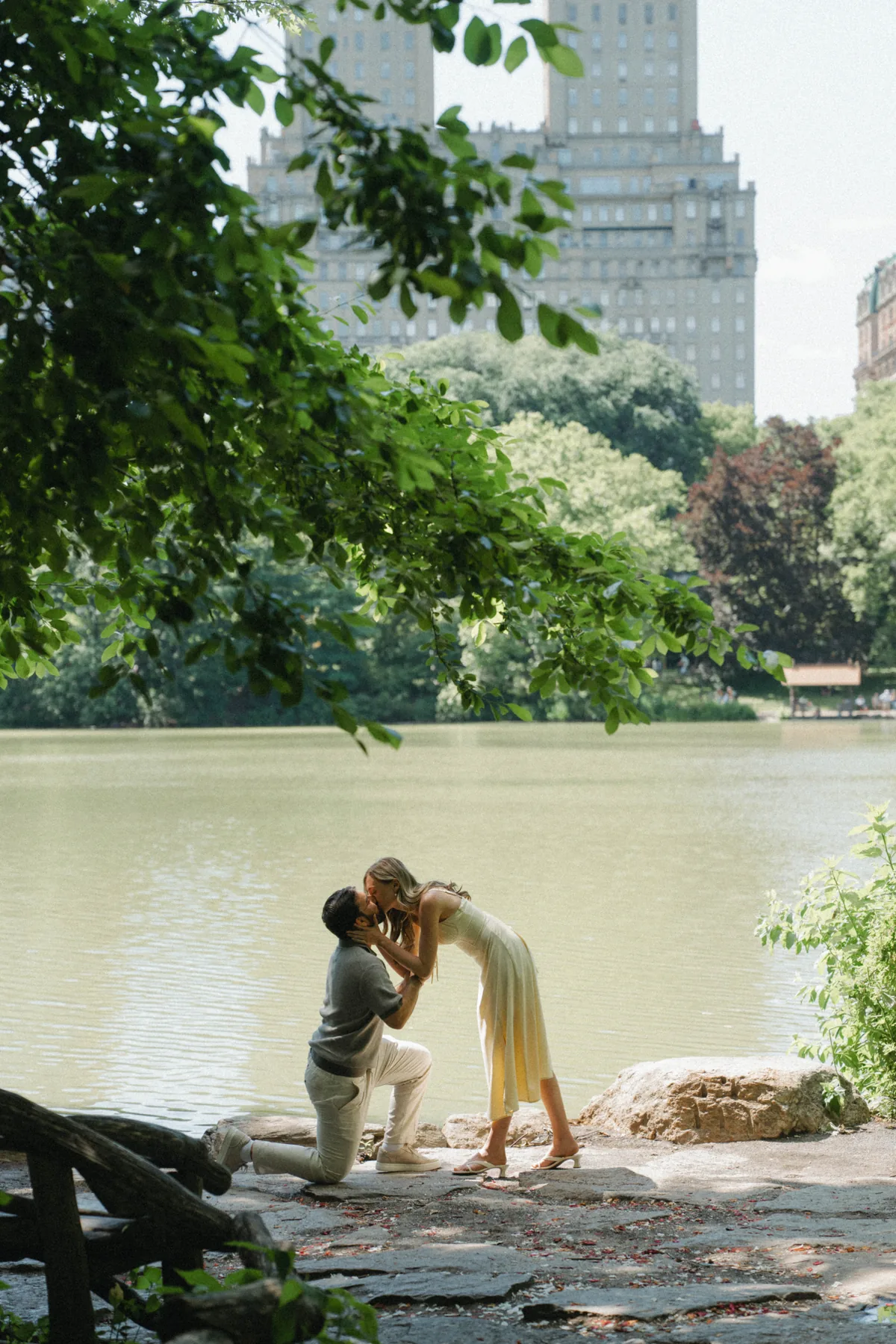 Christopher and Jacqueline celebrating their engagement by the lake
