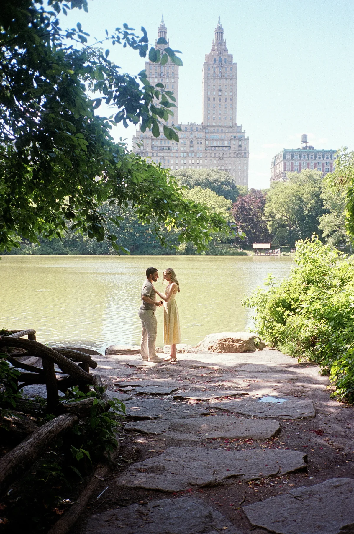 Christopher and Jacqueline standing together by the lake in Central Park