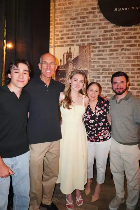Christopher and Jacqueline standing with family