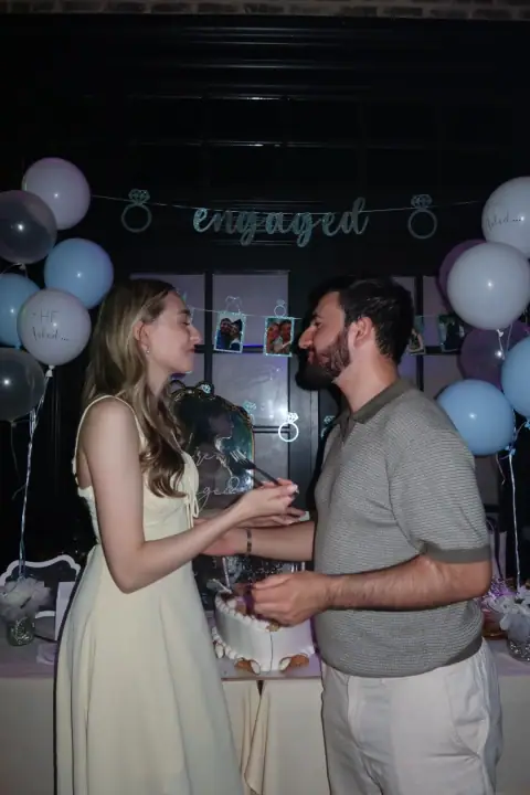 Christopher and Jacqueline sharing a cake moment