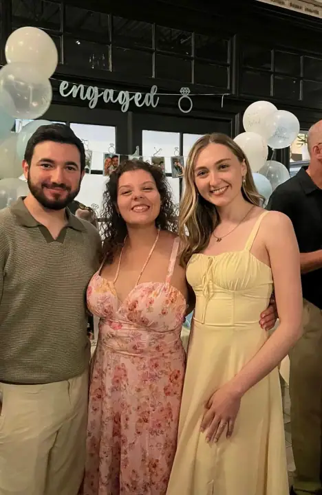 Christopher and Jacqueline smiling with a friend